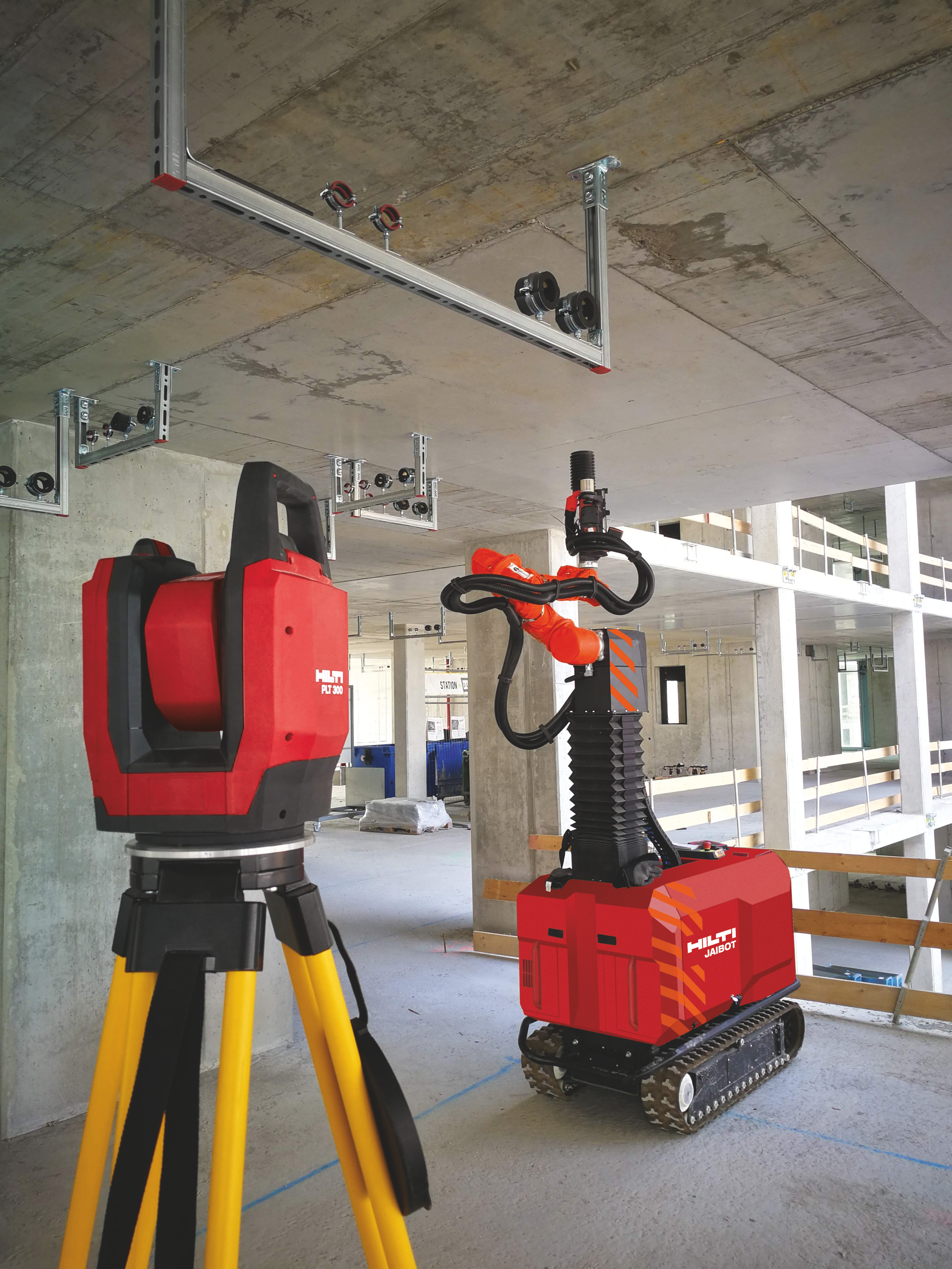 Hilti PLT 300 total station and Jaibot drilling robot on a construction site performing MEP installation.